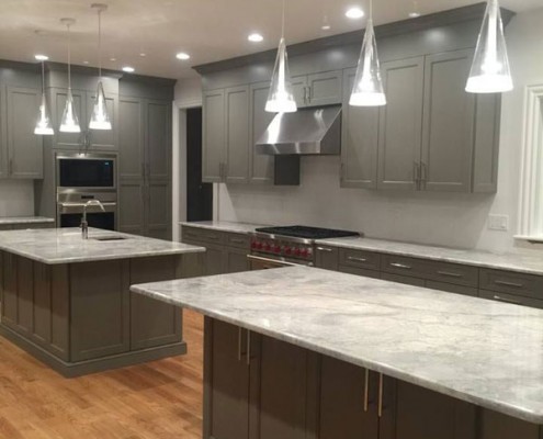 Contemporary gray kitchen with island and range hood