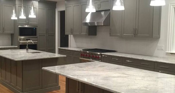 Contemporary gray kitchen with island and range hood