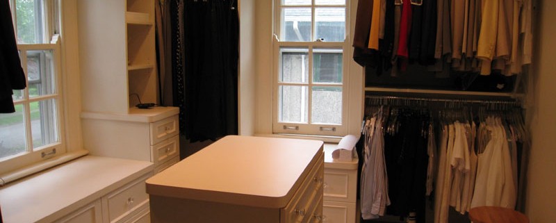 Contemporary white closet with island