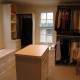 Contemporary white closet with island