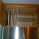 Traditional stained kitchen vertical shelf